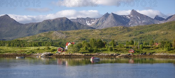 Residential house with boat at the fjord