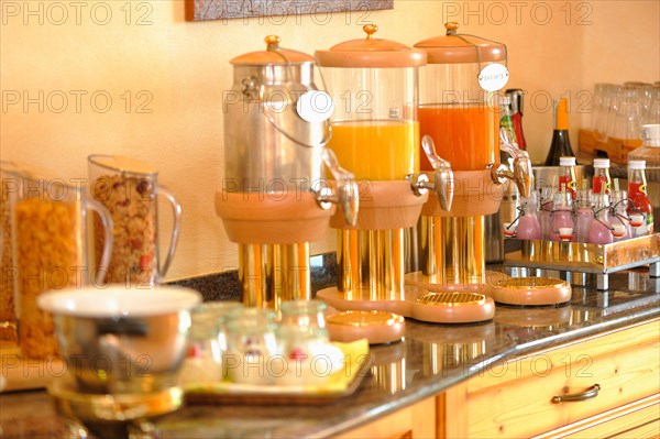 Breakfast buffet with muesli and fruit juices