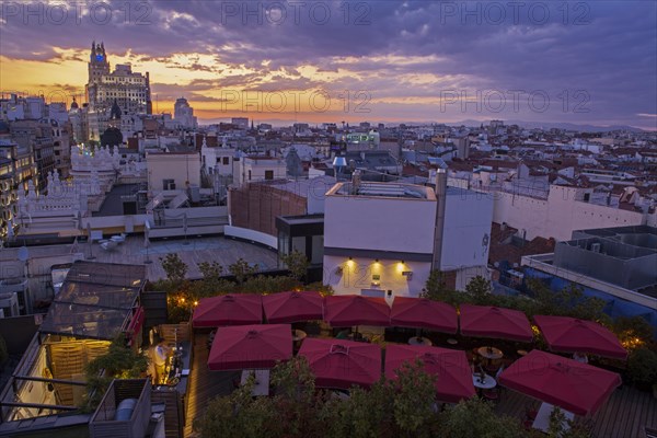 Clients enjoy the beautiful location of the terrace at the Principal Hotel in Gran Via avenue