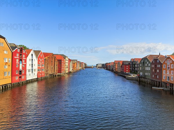 Colourful historic warehouses by the river Nidelva