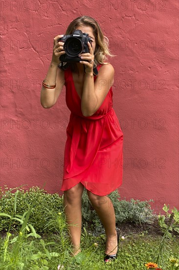 Young woman in red dress