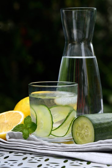 Cucumber water in glass and lemon