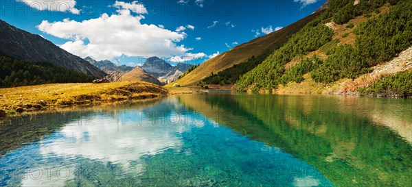 Small mountain lake on the Albula Pass in autumn