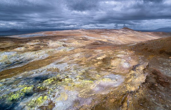 Yellow solfatars in the red rock at Namafjall mountain in the high temperature area Hverir Hveraroend geothermal area in the Myvatn region