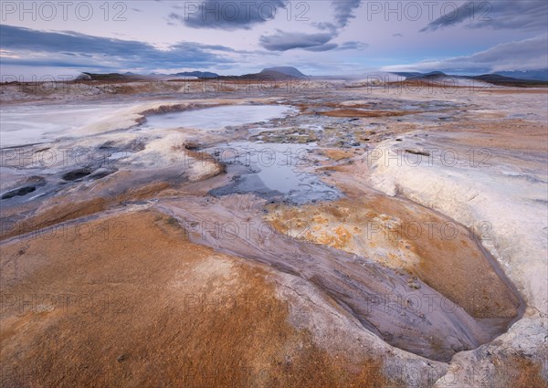 Fumaroles and solfatars in red plain in the high temperature area Hverir Hveraroend geothermal area in the Myvatn region
