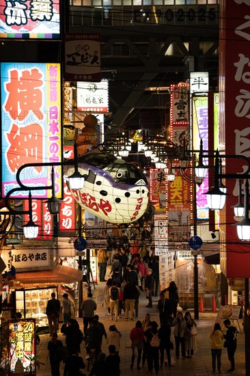 Busy pedestrian area at night