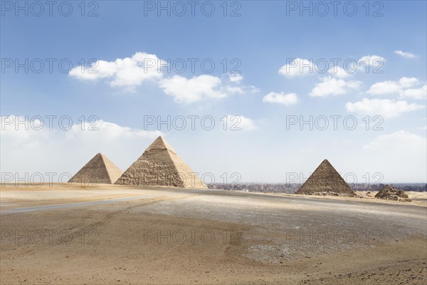 The three main pyramids with Cairo in the background