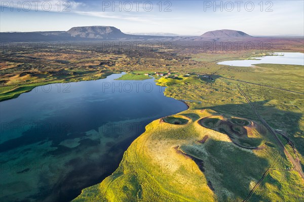 Aerial view of coast with green pseudo-craters