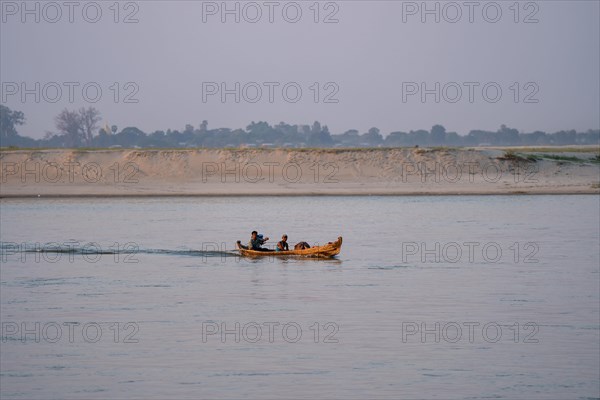 Boat with people goes on Irrawaddy River