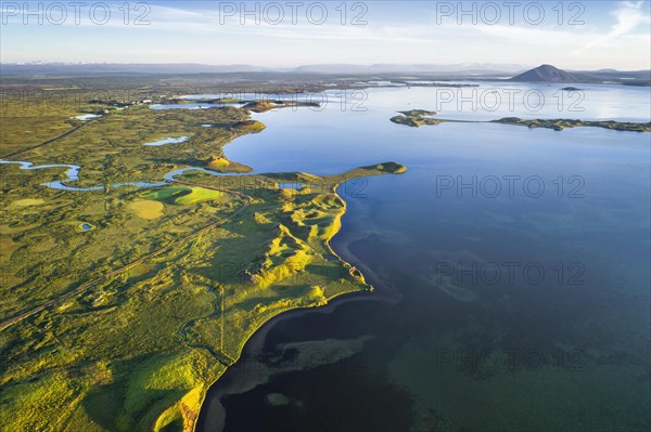 Aerial view of coast with green pseudo-craters