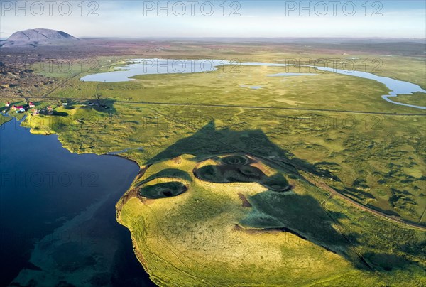 Aerial view of coast with green pseudo-craters