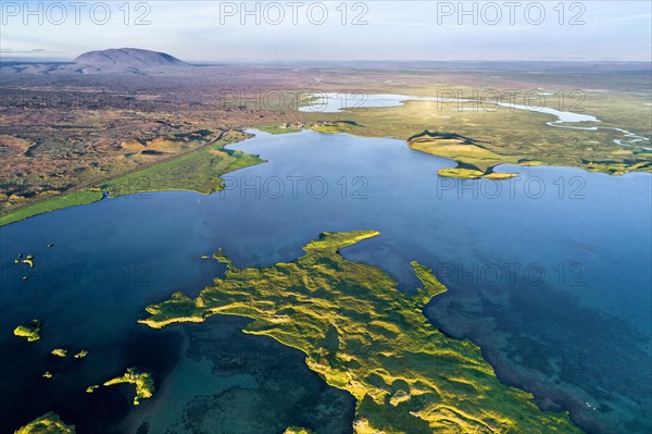 Aerial view of coast with green pseudo-craters