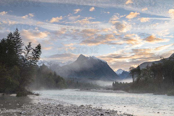 River Soca with Svinjak Mountain in the morning