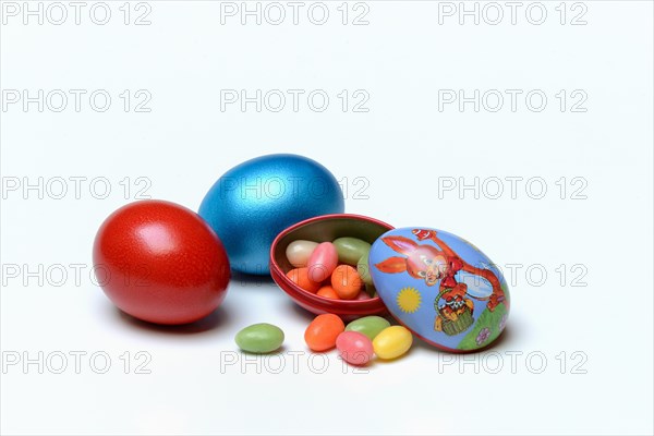 Easter eggs and sugar eggs in tin egg with rabbit figure