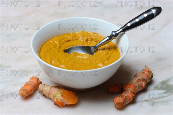 Turmeric paste in shell and turmeric root