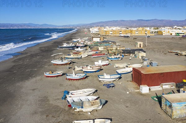 Fishing boats and fishermen cottages at the beach of San Miguel de Cabo de Gata