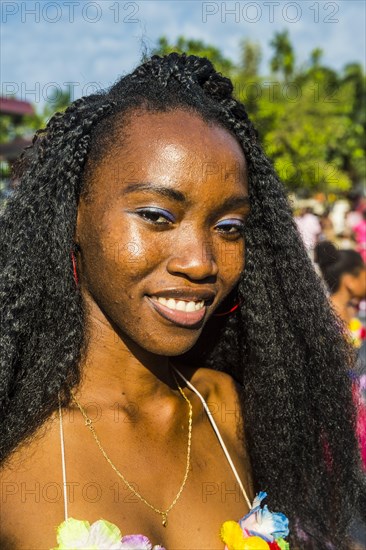 Girl posing at the Carneval in the town of Sao Tome