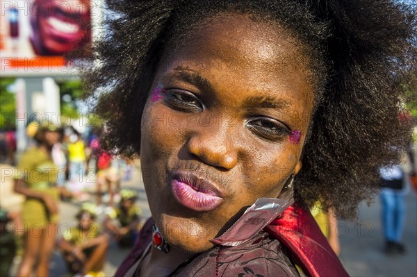 Girl posing at the Carneval in the town of Sao Tome