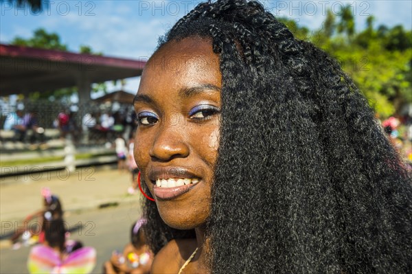 Girl posing at the Carneval in the town of Sao Tome