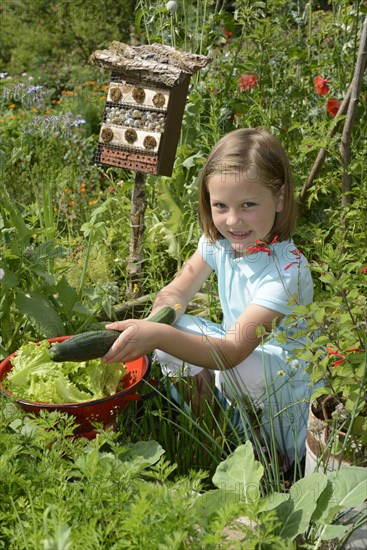 Girl with cucumber