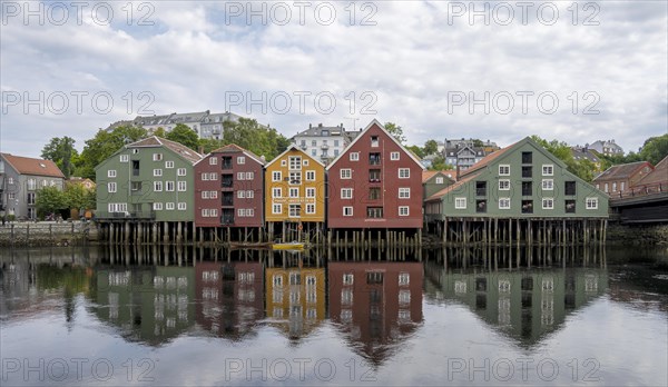 Colourful historic warehouses by the river Nidelva