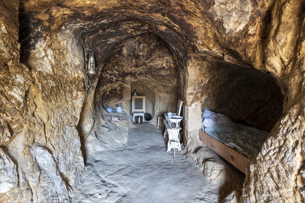 Cave dwelling with sleeping alcove