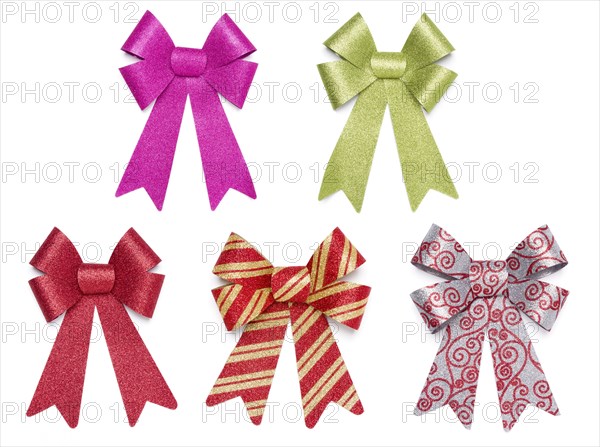 Set of five multicolored glitter bows and ribbons on white background