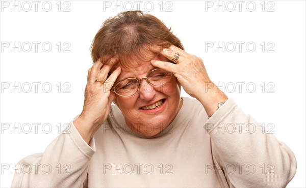Senior woman with aching head isolated on a white background