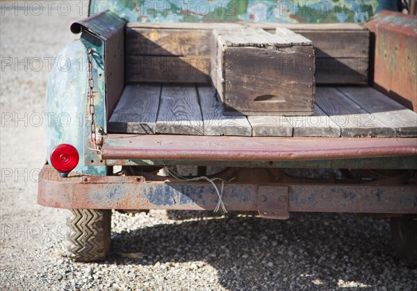 Abstract of old rusty antique truck bed in a rustic outdoor setting