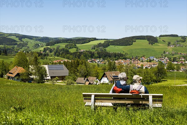 Elderly hiker couple on a bench