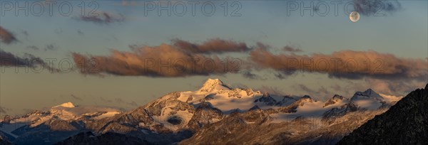 Full moon over summit of Oetztaler Wildspitze