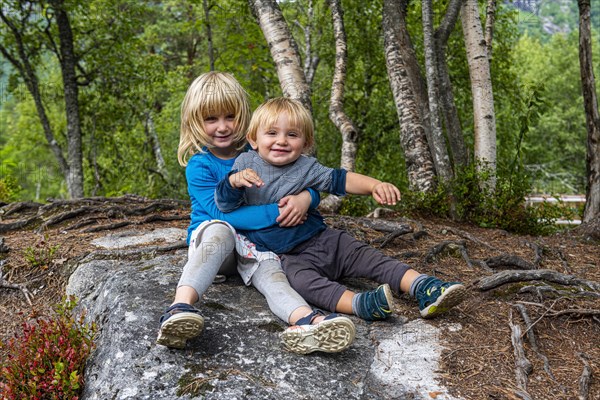 Siblings hugging each other