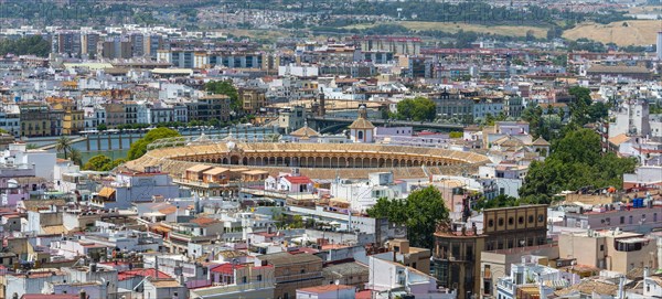 View from above over Seville with bullring Plaza de toros de la Real Maestranza de Caballeria de Sevilla