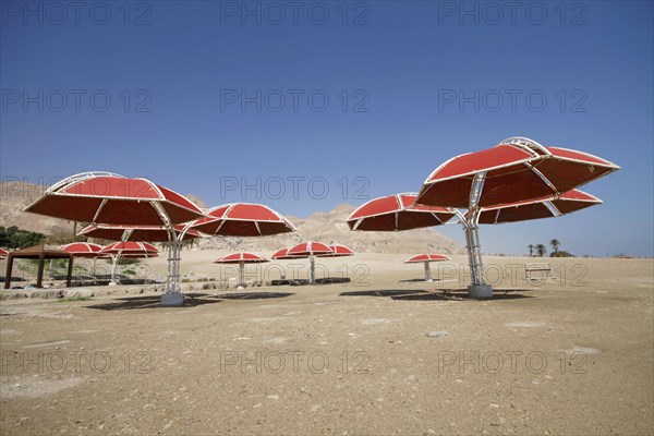 Abandoned parasols on the beach