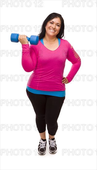 Attractive middle aged hispanic woman in workout clothes lifting dumbbell against a white background