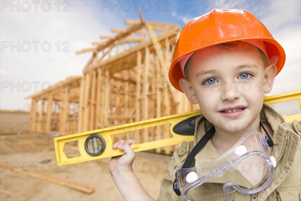 Child Boy Dressed Up As Handyman In Front Of New House Framing ...