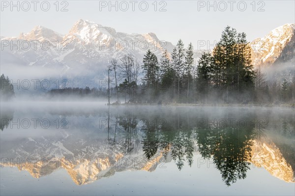 Alpine lake with reflection