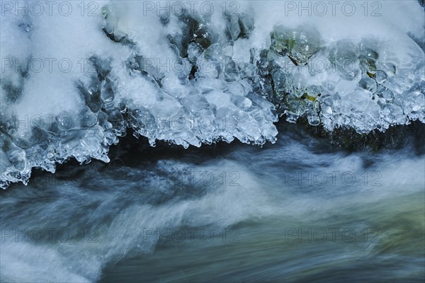 Icicles on wild river in nature reserve Hoelle