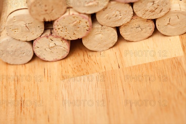 Stack of wine corks on a wood surface