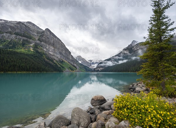 Mountains reflected in turquoise lake