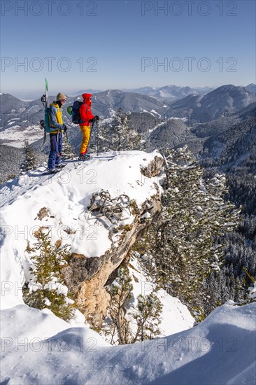 Young woman and man on ski tour