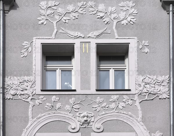 Floral art nouveau reliefs on a residential house from 1908