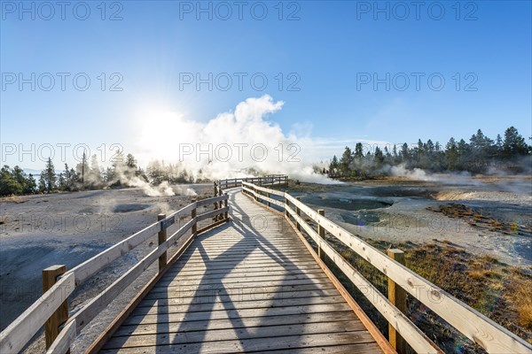 Boardwalk between steaming hot springs