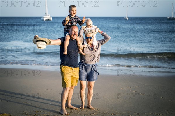 The family with two small boys enjoying the beach