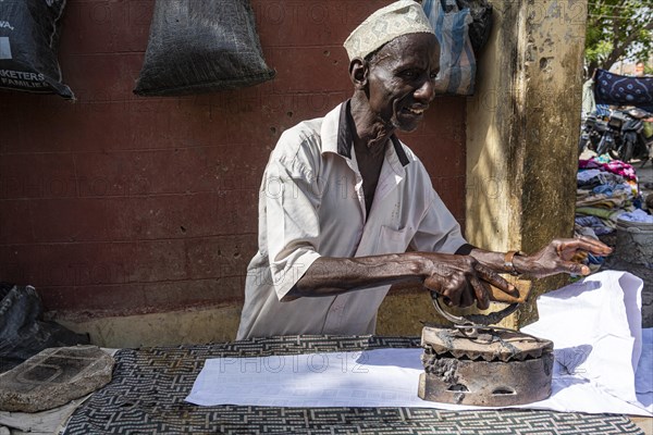 Many ironing with very old iron