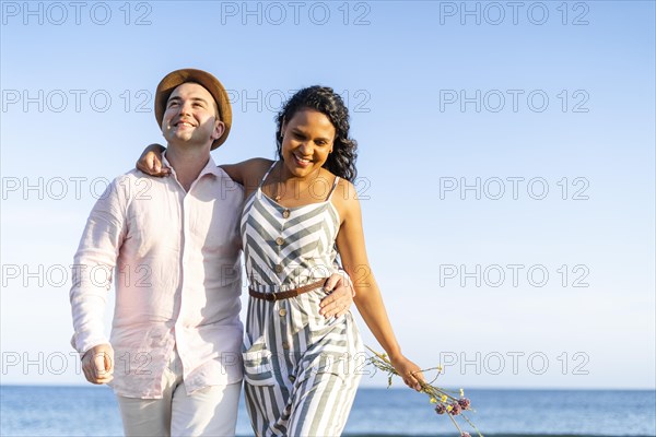 Young couple enjoying time together on the beach in Algarve
