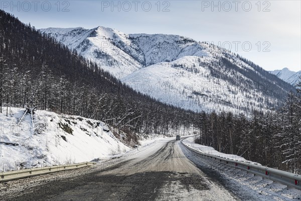 Minivan driving on the Road of Bones