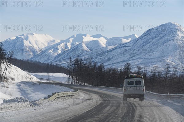 Minivan driving on the Road of Bones