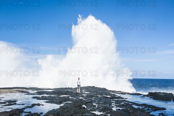 Tourist enjoying the huge waves in the Alofaaga blowholes on the south of SavaiÂ´i