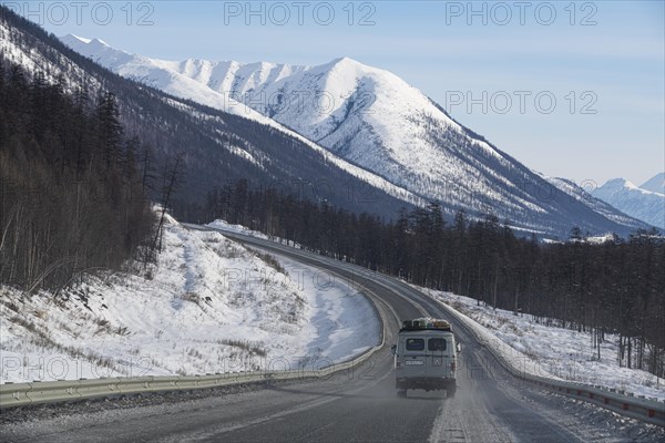 Minivan driving on the Road of Bones